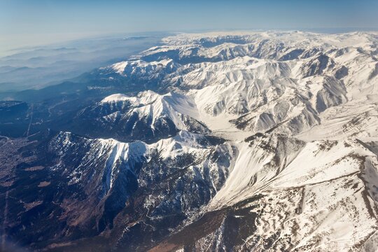 Aerial view of the snow-capped peaks of the Taurus Mountains in Cukurova, Turkey.