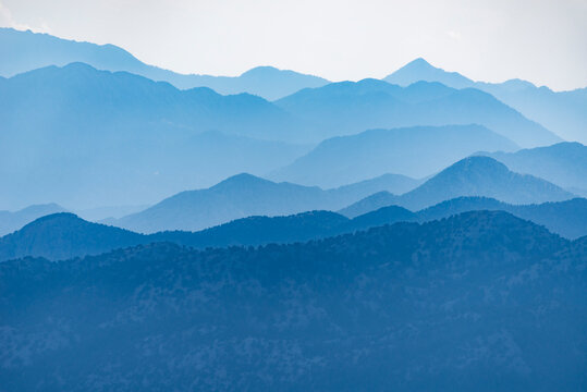 Blue Mountain Ridges Layer Beneath a Soft Evening Sky at Dusk