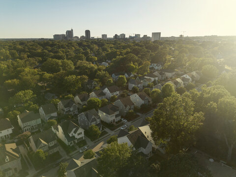 Aerial view of downtown Raleigh, North Carolina housing development with the city skyline in the distance