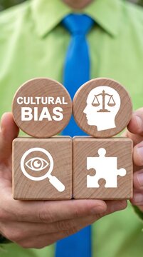 Businessman Holding Wooden Blocks with Cultural Bias, Justice Scales, Magnifying Glass, and Puzzle Piece Icons Representing Diversity, Equity, Inclusion, and Social Awareness.