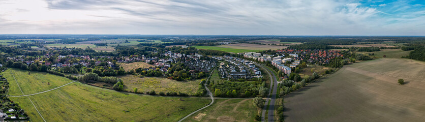 Fototapeta premium Panoramic aerial view of Fahrland residential area and agricultural fields in Potsdam Germany