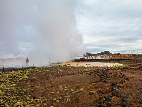 Gunnuhver Hot Springs. Wild Icelandic landscape, lava fields, poor local vegetation, wooden track. Active geothermal area with steam vents, volcanic craters and mud pools. Reykjanes Peninsula, Iceland