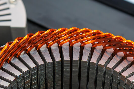 Close up of a stator assembly with copper wire in an EV car motor production process