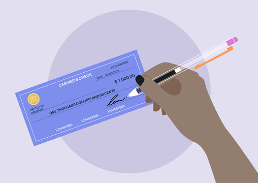 A hand signing a bank paper check, financial operations