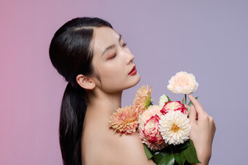 Elegant Woman Holding Pastel Flower Bouquet in Side Profile Portrait © TuongThi
