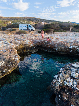 Exploring the tranquil shores of Paros Greece with stunning natural rock formations