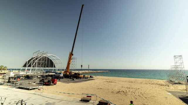 a music stage under construction for a music festival on the beach in barcelona
