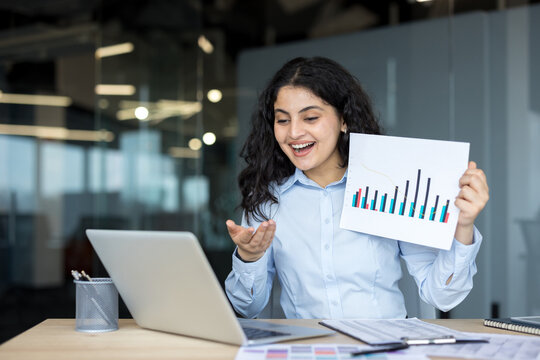 Businesswoman conducting online video meeting presenting financial data