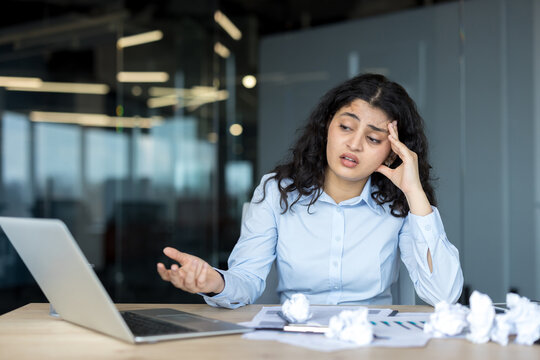 Stressed businesswoman experiencing burnout from work pressure