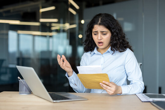 Stressed businesswoman reacting to bad news in office