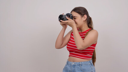 Indian Teenage Girl Clicking Picture with Mirrorless Camera © CineHut