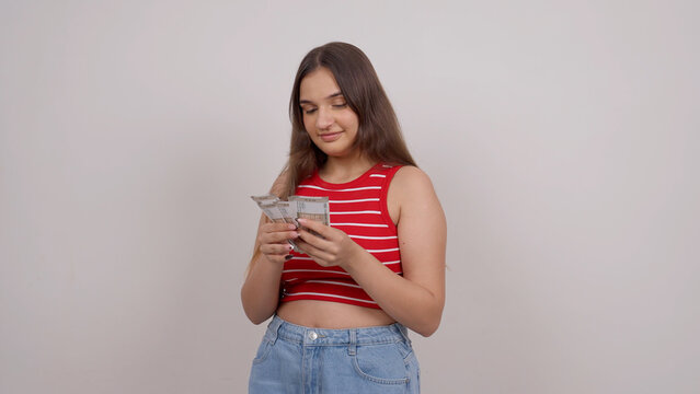 Happy Indian Teenage Girl Counting Money, Indian Rupees