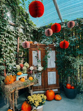 Rustic wooden cabinet decorated with orange paper lanterns and