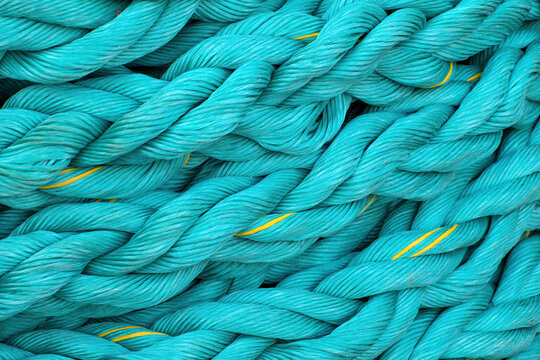 Turquoise fishing ropes and marine lines in close-up