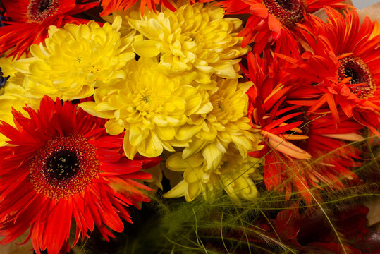 Autumn bouquet with orange and yallow flowers.