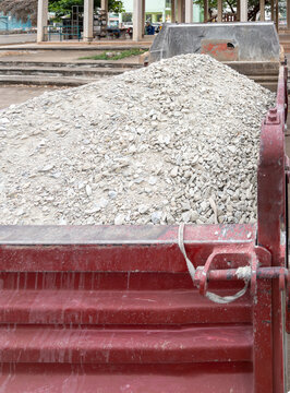 Crushed stone and gravel loaded in a construction dump truck bed