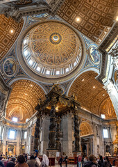 Rome, Italy - April 09, 2026 - Interior View Highlighting the Altar Canopy and Ornate Ceiling in the Center of St Peters Basilica in Vatican City © imagoDens