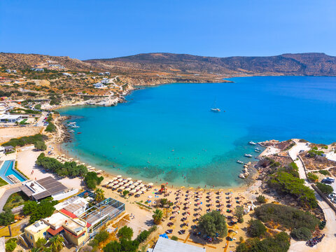 View of sea bay with beautiful beach and traditional church on Karpathos island in Ammopi village, Greece