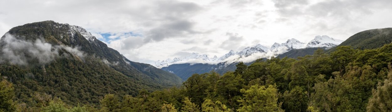 View of snow-capped mountain range with clouds, Pop's View Lookout, Fiordland National Park, Te Anau, Southland, South Island, New Zealand