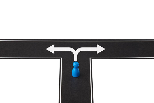 Strategic choice concept with blue pawn standing at road crossroads.