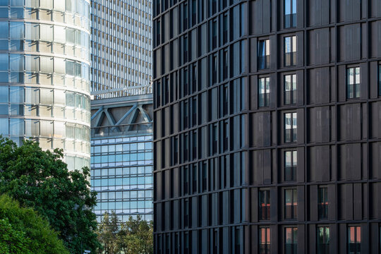 Layered office buildings in Donau City, Vienna, Austria, with facades, glass towers and cityscape elements overlapping across the urban frame