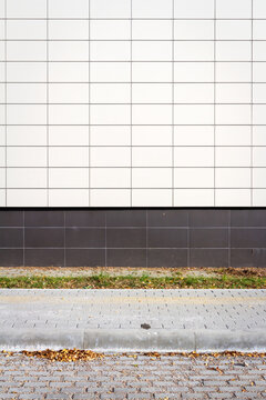 Modern white panel tile wall texture background. Architectural detail.