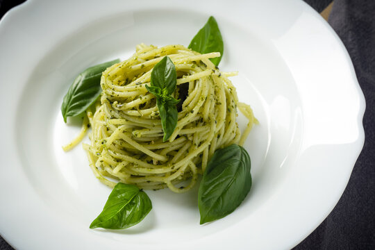 Spaghetti with pesto Genovese. Close up. Italy food.