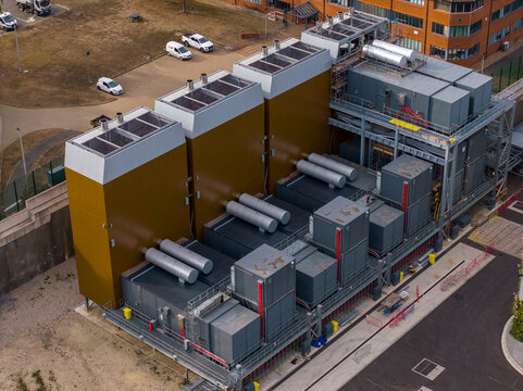 Aerial view of Ark Data Centres at Longcross Park featuring industrial cooling units and technical infrastructure in Chertsey, England, United Kingdom.