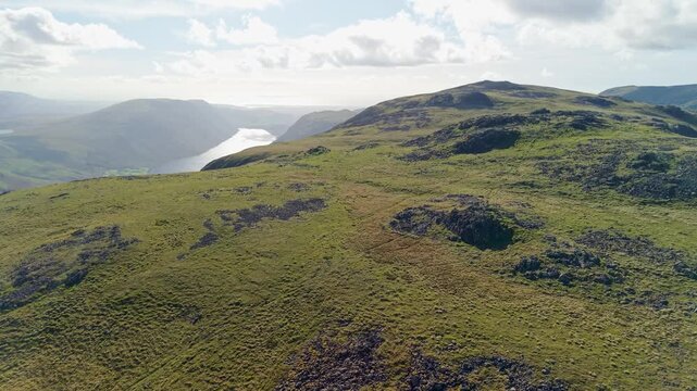 Aerial panoramic view of the Kirk Fell summit from the Great Cable Pike. Scenic Drone POV Exploration of the Lake District National Park, Cumbria, UK.