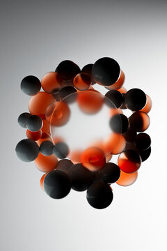 Circular Cluster of Orange and Black Abstract Spheres