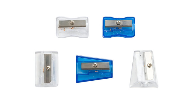 Five different pencil sharpeners with metal blades arranged on a solid black background