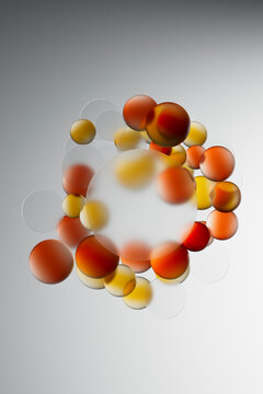 Orange and Yellow Spheres Circular Abstract Frame