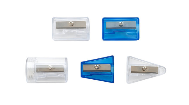 Five different pencil sharpeners with metal blades arranged on a solid black background