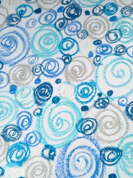A continuous background pattern of blue, light blue, and silver spirals and swirls on white.