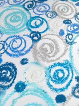 A continuous background pattern of blue, light blue, and silver spirals and swirls on white.