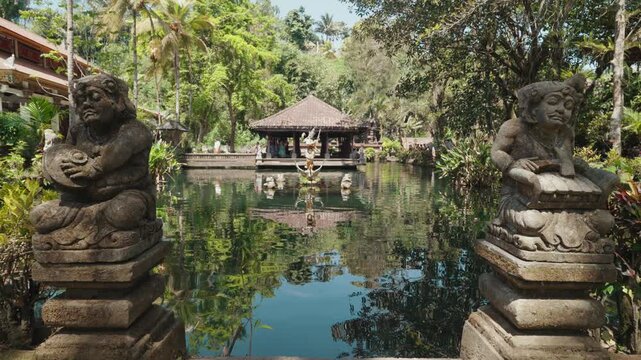 Pura Gunung Kawi Sebatu temple complex surrounded by lush tropical vegetation and sacred water ponds in Ubud, Bali, Indonesia