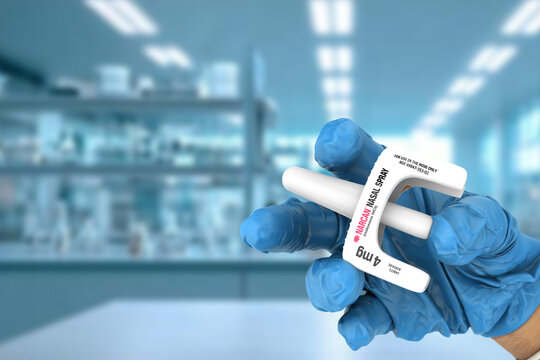A doctor holds Narcan, a Naloxone nasal spray used for emergency opioid overdose reversal. This product is used in healthcare, addiction treatment, public health, and pharmaceuticals