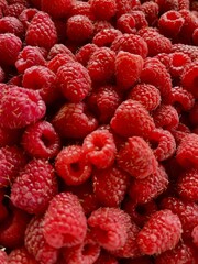 Fresh ripe raspberries close up as natural food background © liliya
