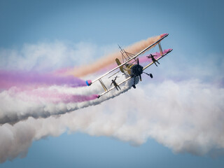 This image shows a file manager gallery displaying various photographs of airplanes and helicopters performing aerial maneuvers and stunts at an airshow © @CMG_IG