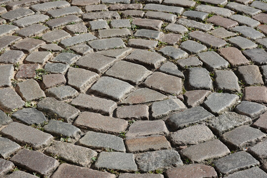 historic cobblestone street paved in round circle pattern