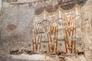 Rome, Italy - April 09, 2026 - Ancient Roman Wall Paintings Inside the Temple of Divus Romulus in the Roman Forum, Rome © imagoDens