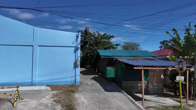 Narrow village street between houses in Cebu, Philippines