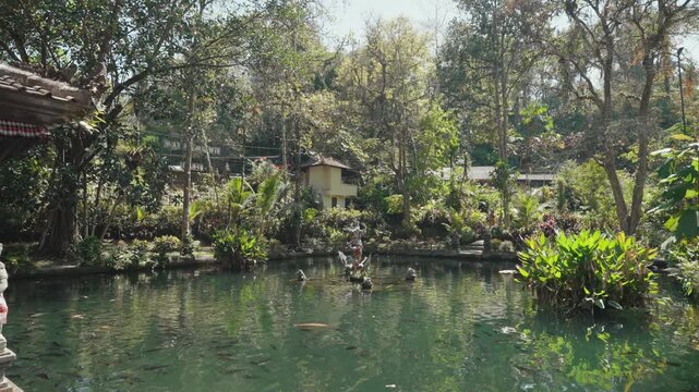 Sacred shrine and traditional Balinese temple architecture surrounded by tropical greenery at Pura Gunung Kawi Sebatu, Ubud