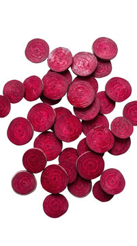 Fresh red beetroot slices and rounds scattered isolated on white background for healthy salad cooking menu