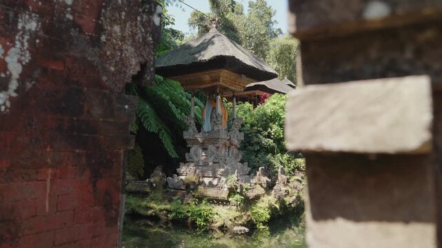 Sacred shrine and traditional Balinese temple architecture surrounded by tropical greenery at Pura Gunung Kawi Sebatu, Ubud