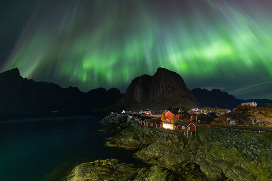 Breathtaking winter view on Hamnoy village at night with Northern lights, Aurora Borealis. Popular tourist destination on Lofotens. Location, Hamnoy, Moskenesoya , Lofoten, Reine Norway, Europe