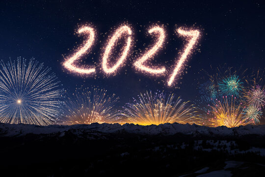 Amazing real beautiful colorful fireworks background on celebration night event for happy new year party, Abstract Multi color golden firework in the night sky. 2027 New Year Concept.