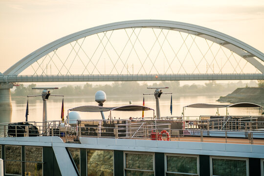 View of the Zezelj Bridge over the Danube River with a river cruise ship in the foreground, Novi Sad, Vojvodina, Serbia.