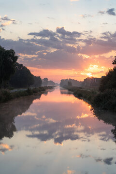 A tranquil, foggy dawn over a canal in the countryside. Meerstad, the Netherlands.