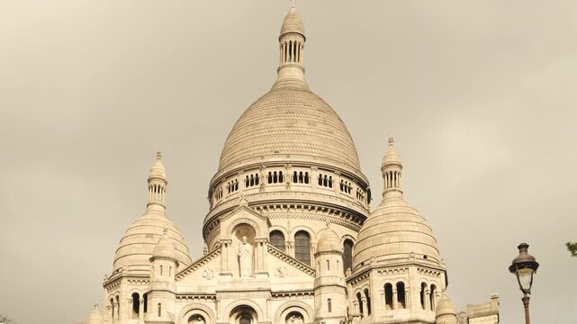 Sacr&eacute;-C&oelig;ur Basilica with White Domes and Historic Architecture in Montmartre, Paris, France